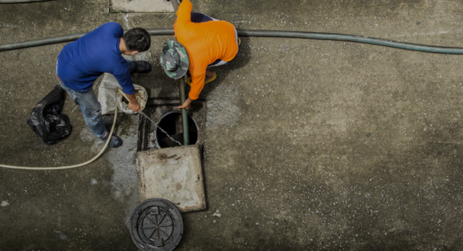Plumber Fixing Drain